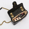 A black felt handbag organizer insert with multiple pockets and gold-toned hardware.