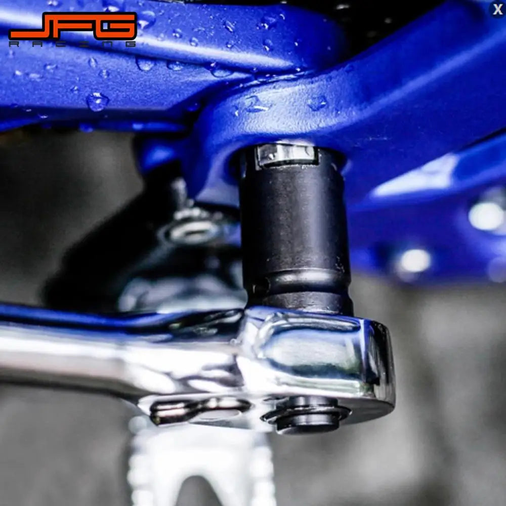 Close-up of a black 4-pin lock nut removal socket being used on a blue electric bike component.