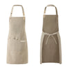 A light beige waterproof canvas chef apron with a tie closure and front pocket.