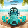 A teal crab toy is shown with removable claws on a sandy beach background.