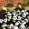 A collection of handmade crochet kitten keychains featuring cute panda and cartoon animal charms.