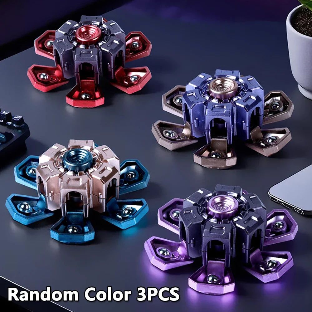 Three random color fidget spinners shown on a dark surface.
