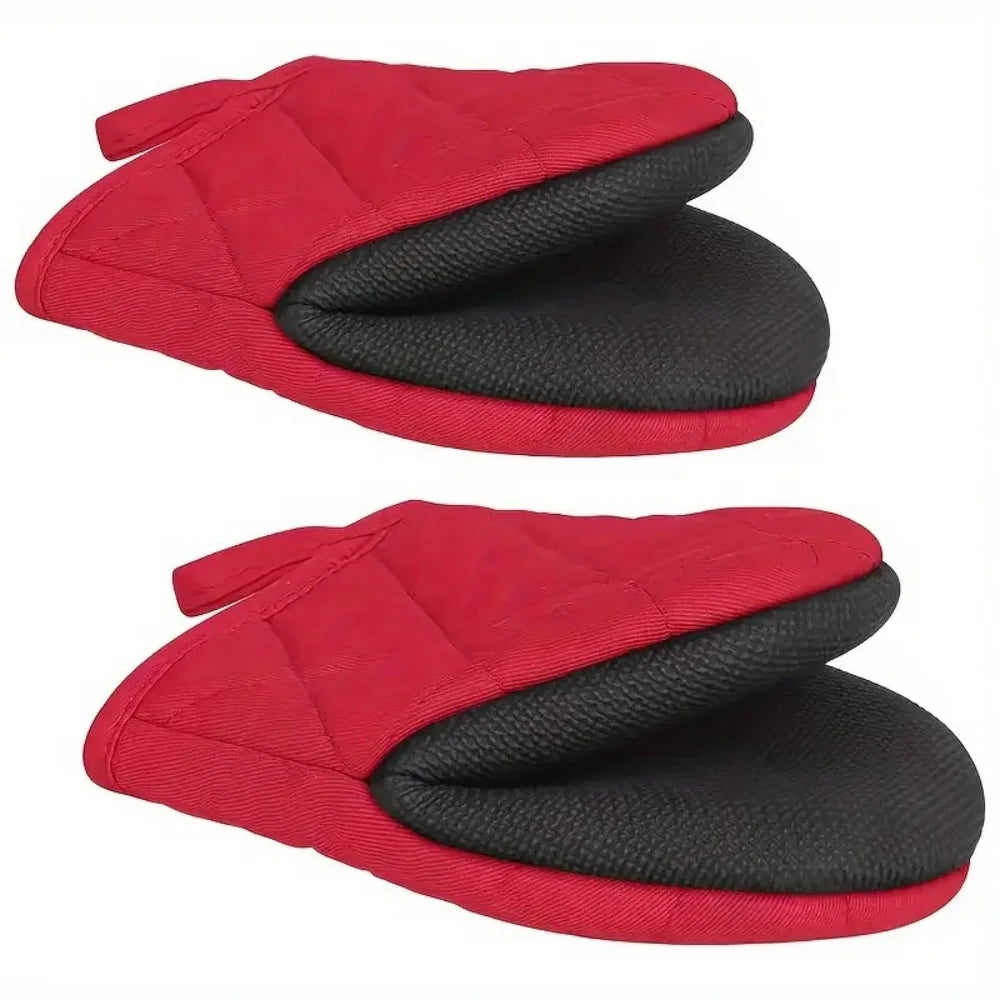 A pair of red heat-resistant silicone oven mitts with black non-slip grips shown from the top.