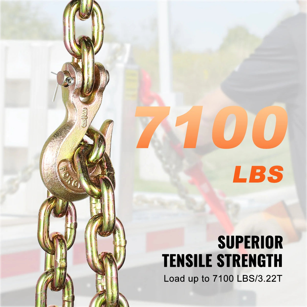A close-up of a heavy-duty gold-colored binder chain with a clevis hook, demonstrating superior tensile strength.