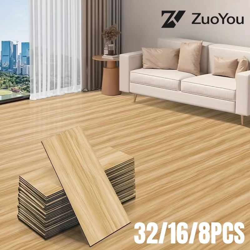 A set of 32 floor tiles in light wood grain pattern displayed on a wooden floor.