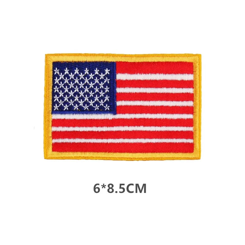 A rectangular embroidered patch of the American flag featuring blue stars and white stripes on a red field.