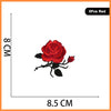 A red rose embroidered iron-on patch measuring 8.5 cm wide.