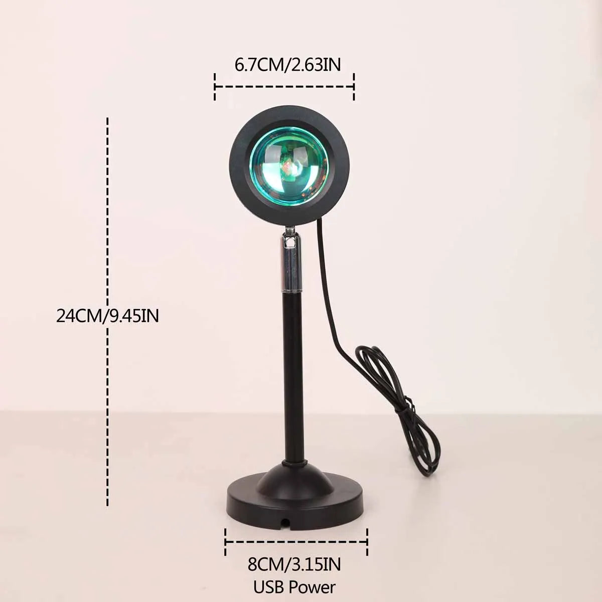 A black USB sunset projection light with a circular lens and stand is shown.