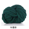 A ball of dark green chunky acrylic yarn used for knitting and crochet