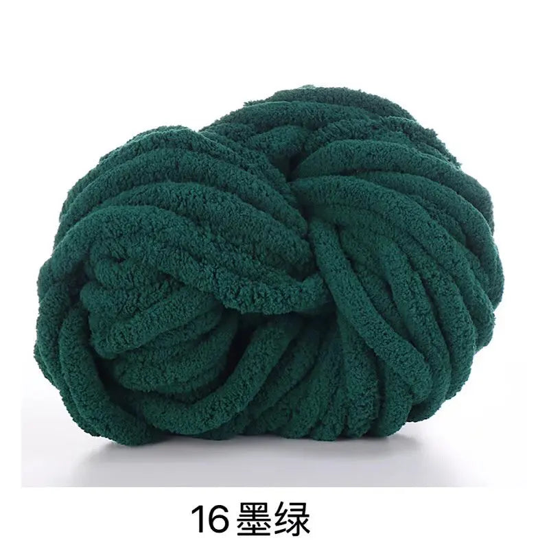 A ball of dark green chunky acrylic yarn used for knitting and crochet