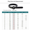 A black ring sizer measuring tool with a scale and magnifier is shown.