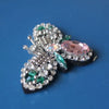 Handcrafted rhinestone bee sew-on patch featuring silver and pink stones on a black background