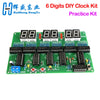 A green circuit board displaying eight 8-digit LED displays and various electronic components for a DIY clock kit.