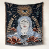 A dark tapestry featuring a face surrounded by sun rays and leaves with the text Tomorrow is another day
