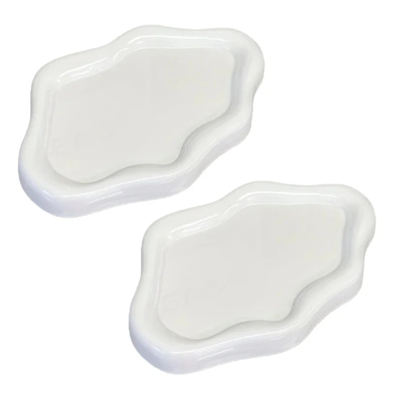 A white cloud-shaped jewelry tray with gently curved edges.