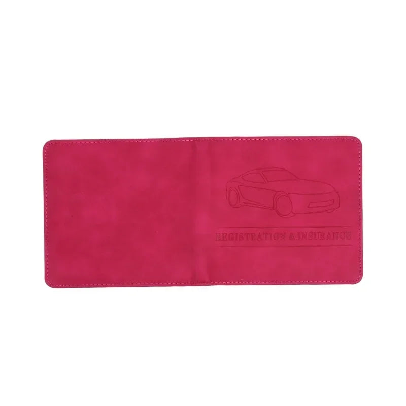 A pink leather document holder with a silhouette of a car embossed on it.