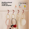 A display of multifunctional hanging hooks for hats and scarves on a wall rack.