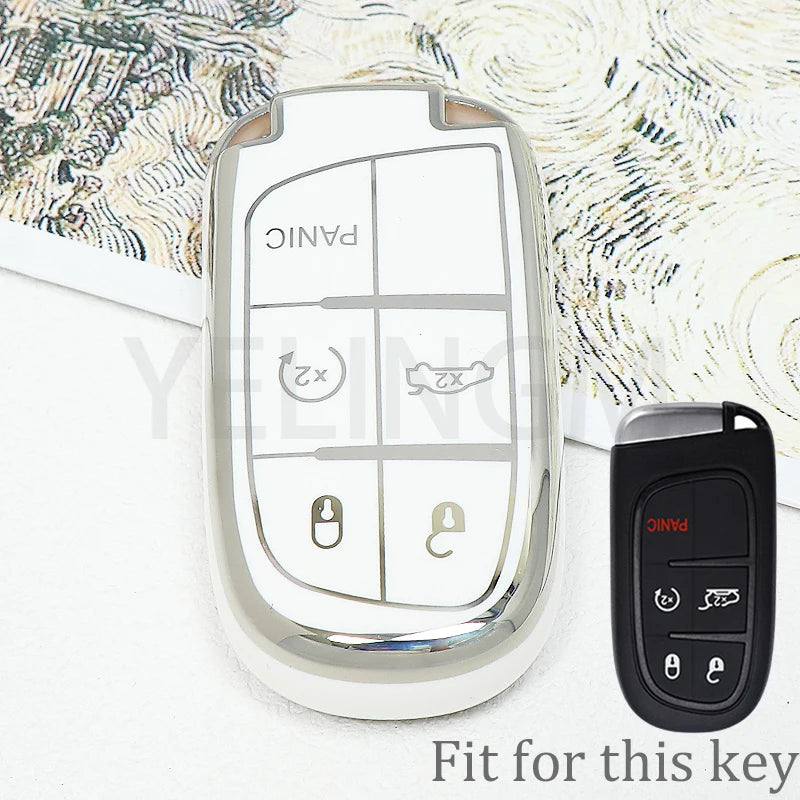 A clear plastic key fob cover for a car key, showing panic and unlock buttons, next to a black replacement key.