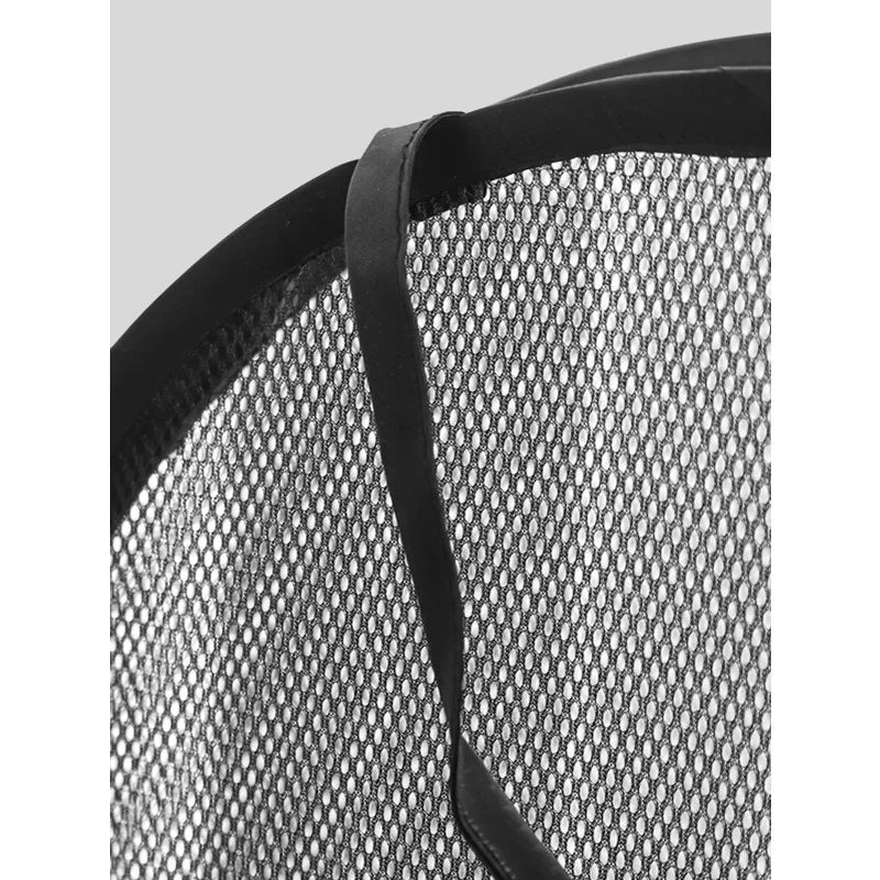 Close-up view of a black mesh foldable laundry hamper with a black strap.