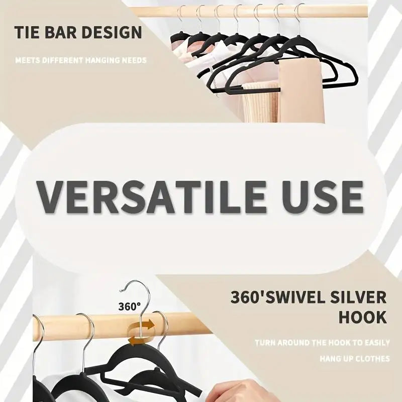 A set of black velvet hangers with 360° swivel hooks shown hanging on a wooden rack.