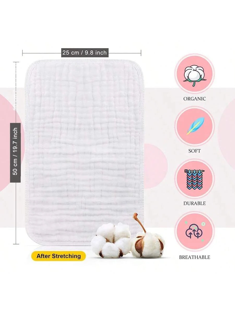A white organic soft and durable muslin burp cloth shown next to a bundle of cotton balls.