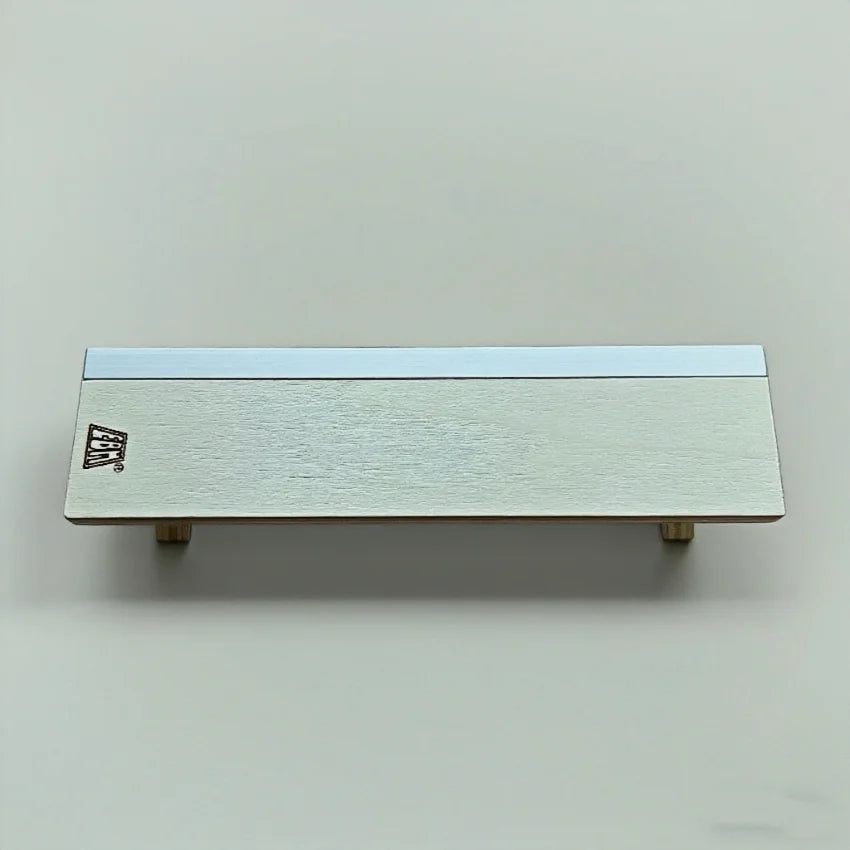 A silver portable fingerboard ramp set featuring a quarter pipe and rail.