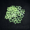 A pile of light green glow-in-the-dark 3D star wall stickers for kids' rooms and bedrooms.
