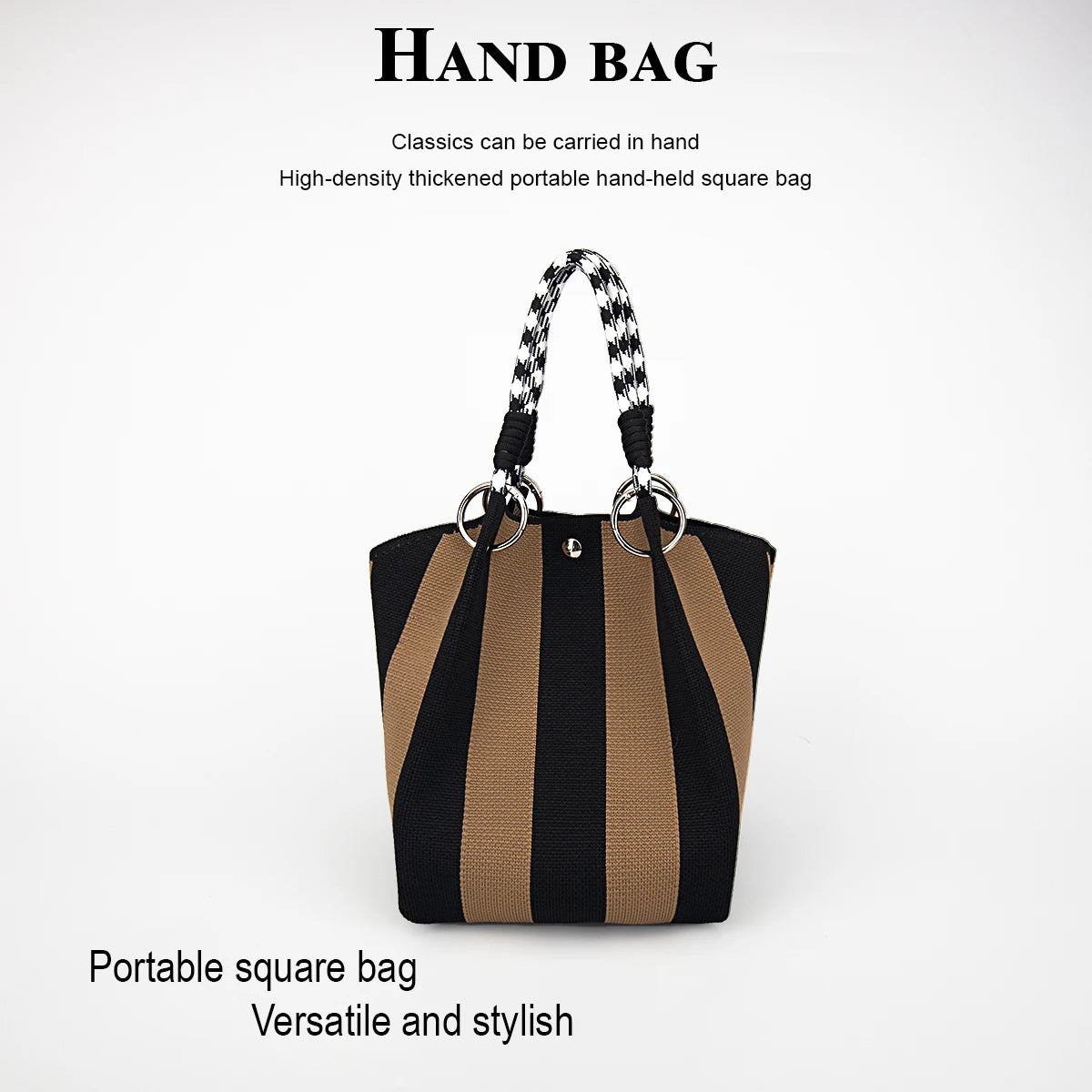A black and tan striped square hand bag with a braided strap is shown against a white background.