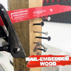 A close-up of a red blade for a bi-metal reciprocating saw, showing nail-embedded wood and various size screws.