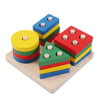 A set of colorful wooden peg puzzles featuring alphabet and number shapes stacked in various arrangements.