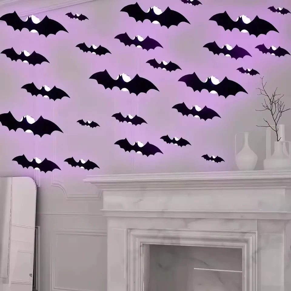 Wall décor featuring purple glowing bat silhouettes on a white wall above a marble mantelpiece.