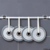 A set of two silver self-adhesive no-drill curtain rod brackets with white cords are hanging on a white rod.