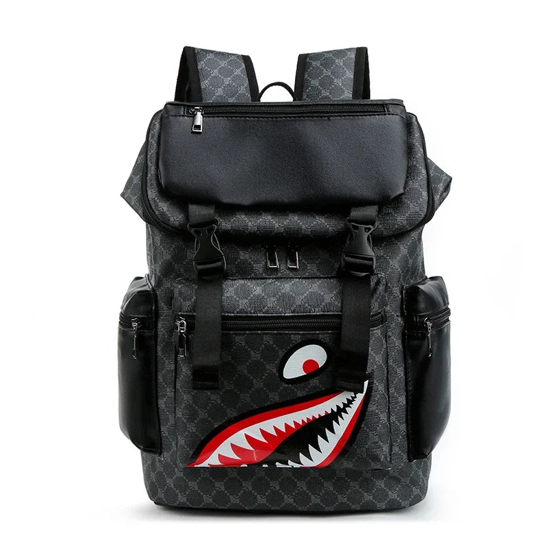 Black backpack with a shark mouth graphic and black PU leather accents