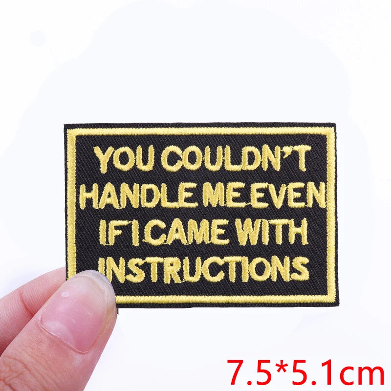 Black embroidered iron-on letter patch with yellow text that reads You couldn't handle me even if I came with instructions