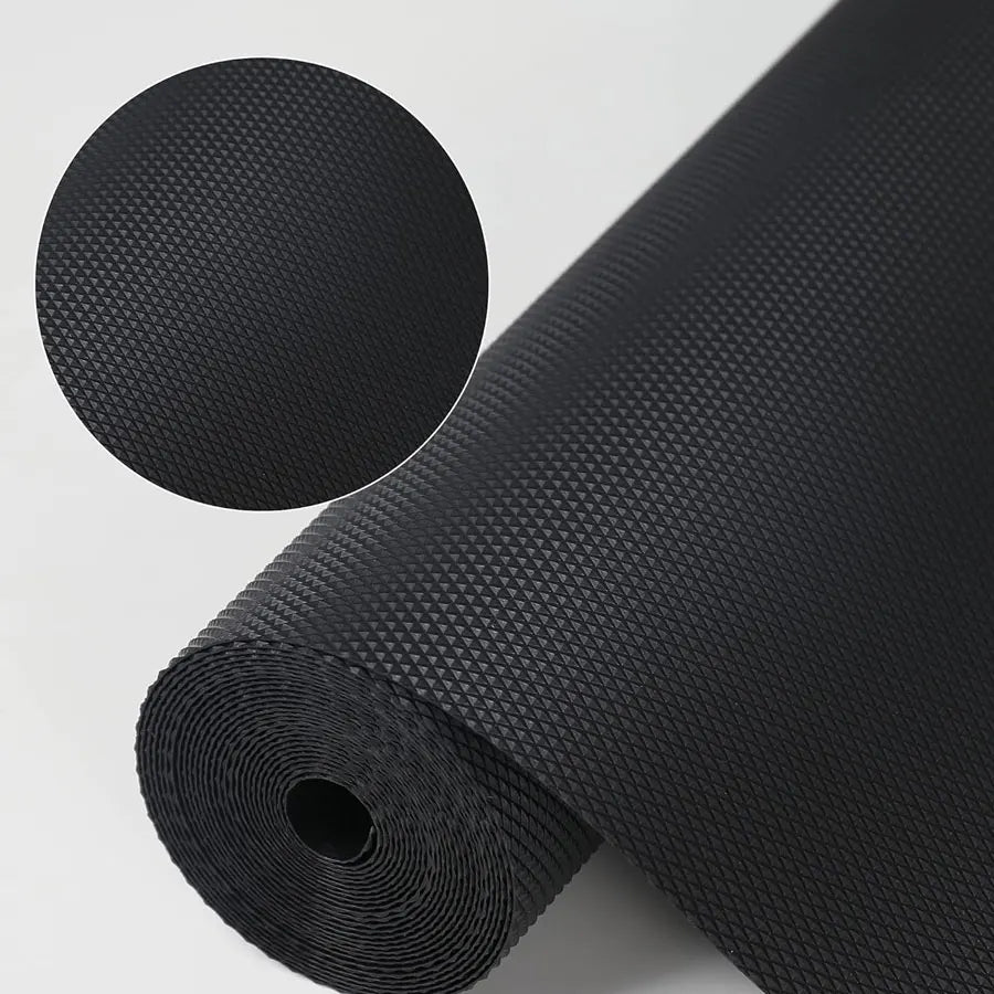 Black EVA waterproof non-slip drawer and shelf liner mat rolled up with a circular detail view.
