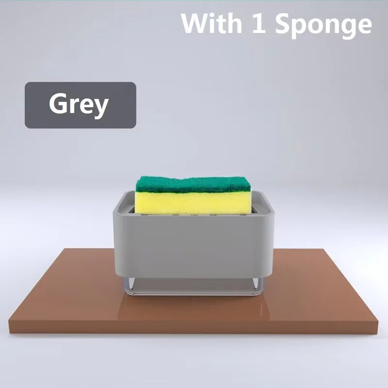 A grey kitchen soap dispenser holding a green sponge on a wooden surface.