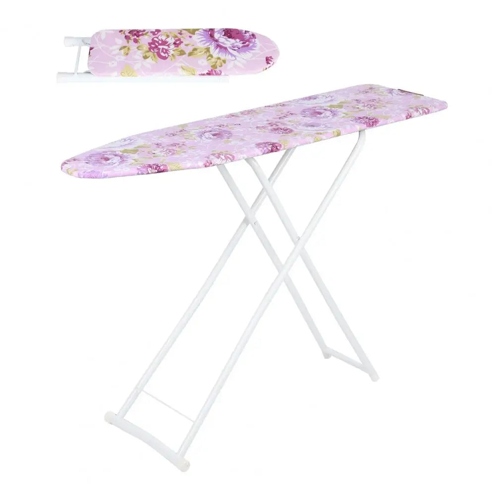 A pink floral patterned foldable ironing board with a white metal frame.