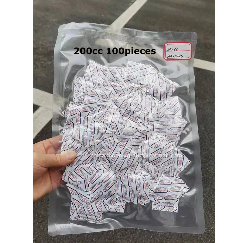 A clear plastic bag filled with 100 food grade oxygen absorbers for long-term dry food storage