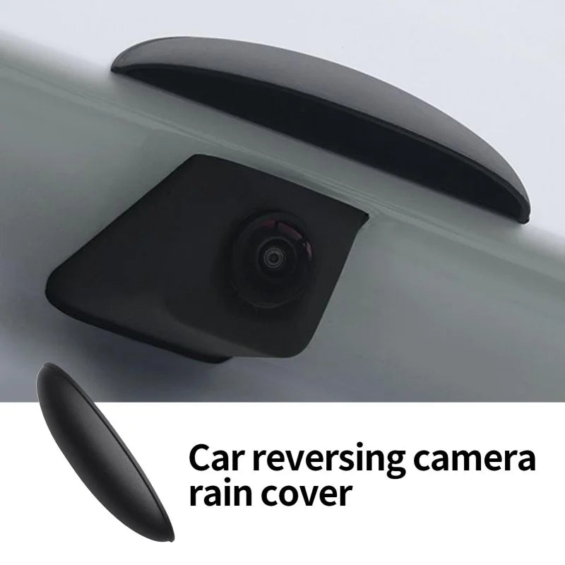 A black car reversing camera rain cover is shown mounted on a vehicle body.