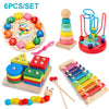 A set of wooden puzzles including a stacking tower, an elephant toy, and various wooden blocks and puzzles for toddlers.