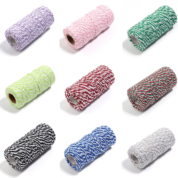 A collection of various colored twine string cord rolls for crafting and decor.