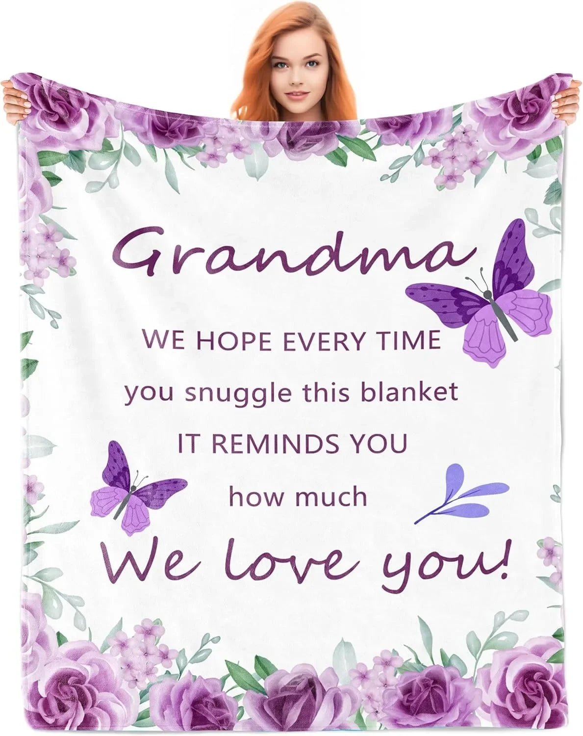 A woman smiles while holding a purple floral blanket with text that says We love you
