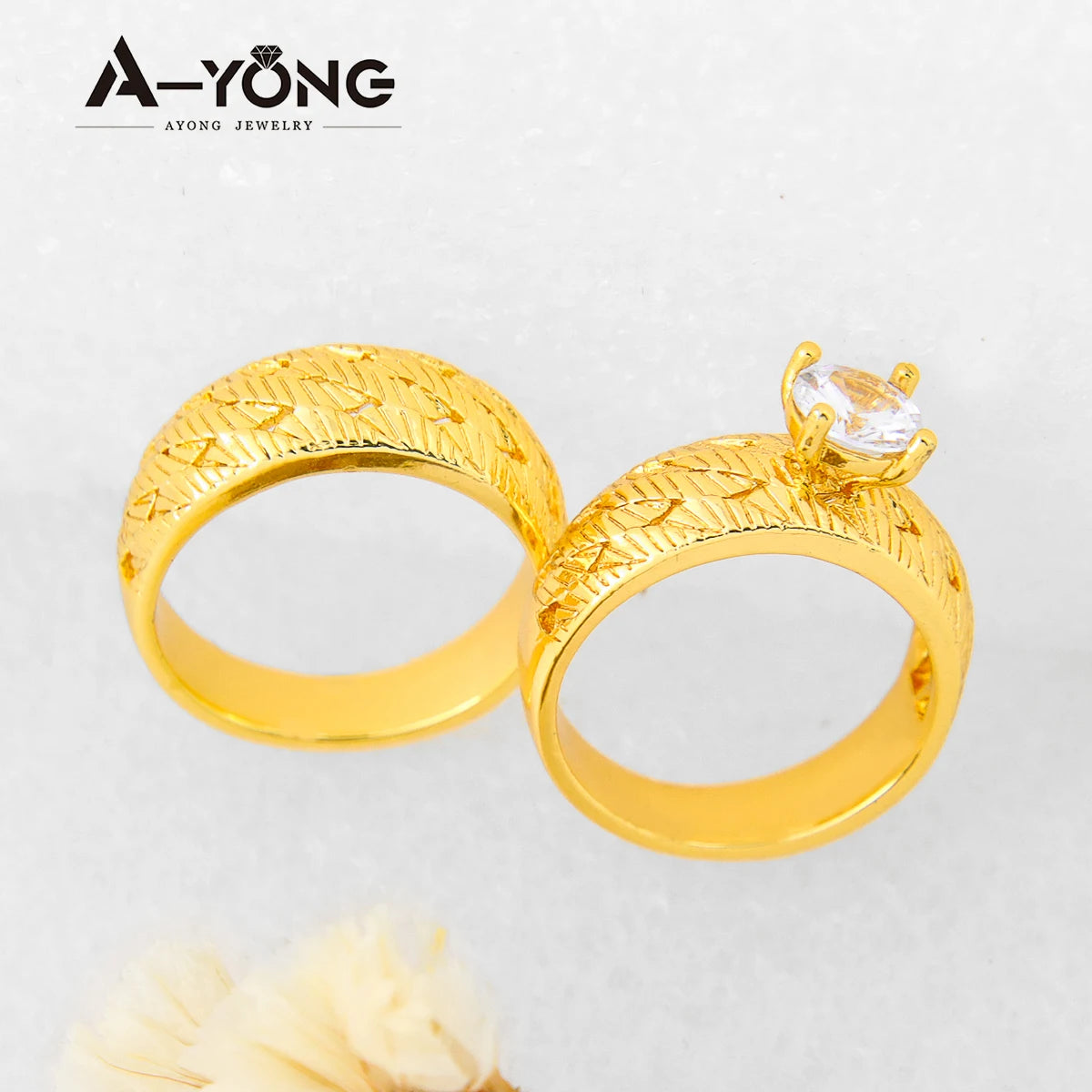 A pair of elegant gold-plated zirconia stackable rings shown against a light background.