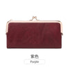 A maroon leather wallet with gold hardware shown against a white background.