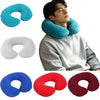 A man is wearing a teal inflatable U-shaped travel neck pillow, with separate white and red versions shown nearby.