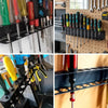 A close-up view of a wall-mounted tool organizer holding various hand tools like pliers, screwdrivers, and wrenches.