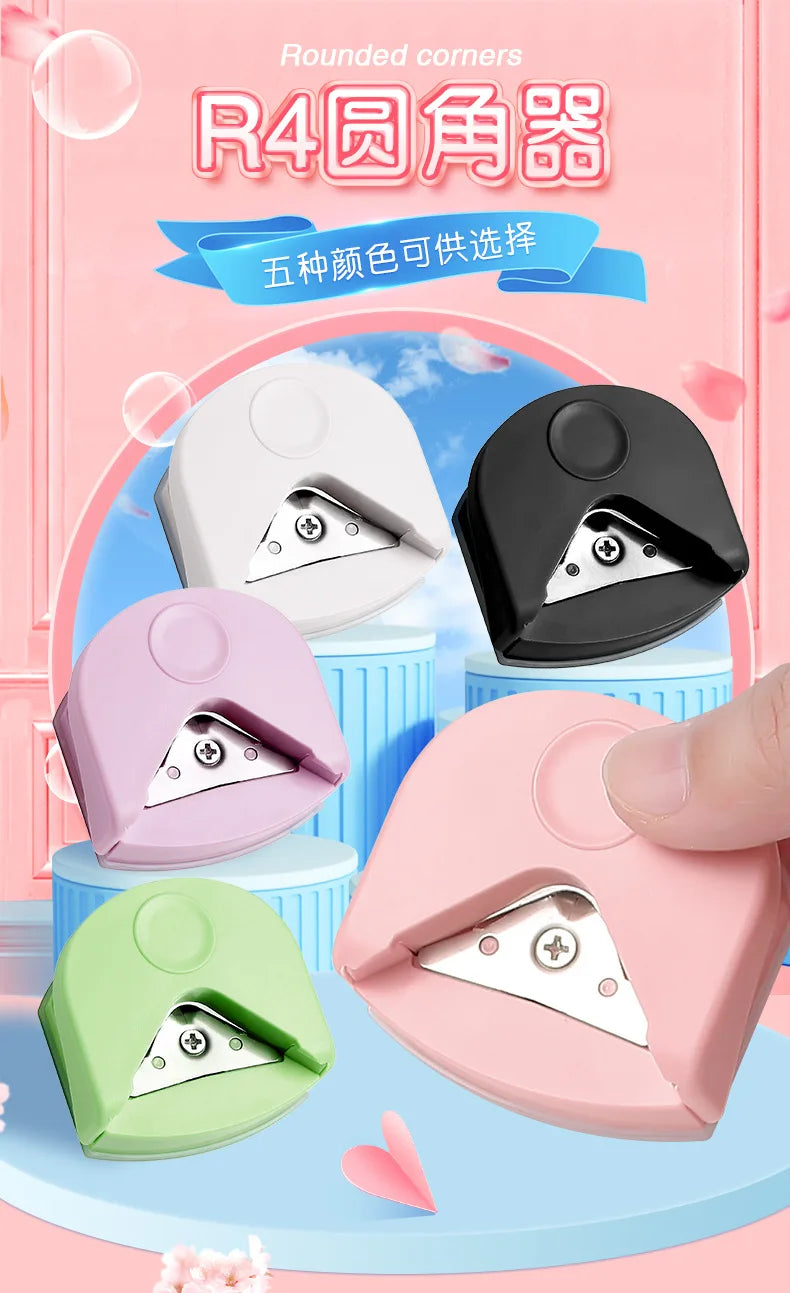 A collection of five pink and white rounded corner cutters for DIY crafts displayed on a light blue background.