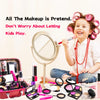 A young girl is smiling while holding a makeup brush, surrounded by various makeup products and an open carrying case.