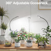 A 360° adjustable gooseneck grow light illuminating various indoor plants on a wooden table.