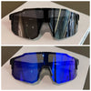 A pair of blue polarized sunglasses displayed on a white surface.